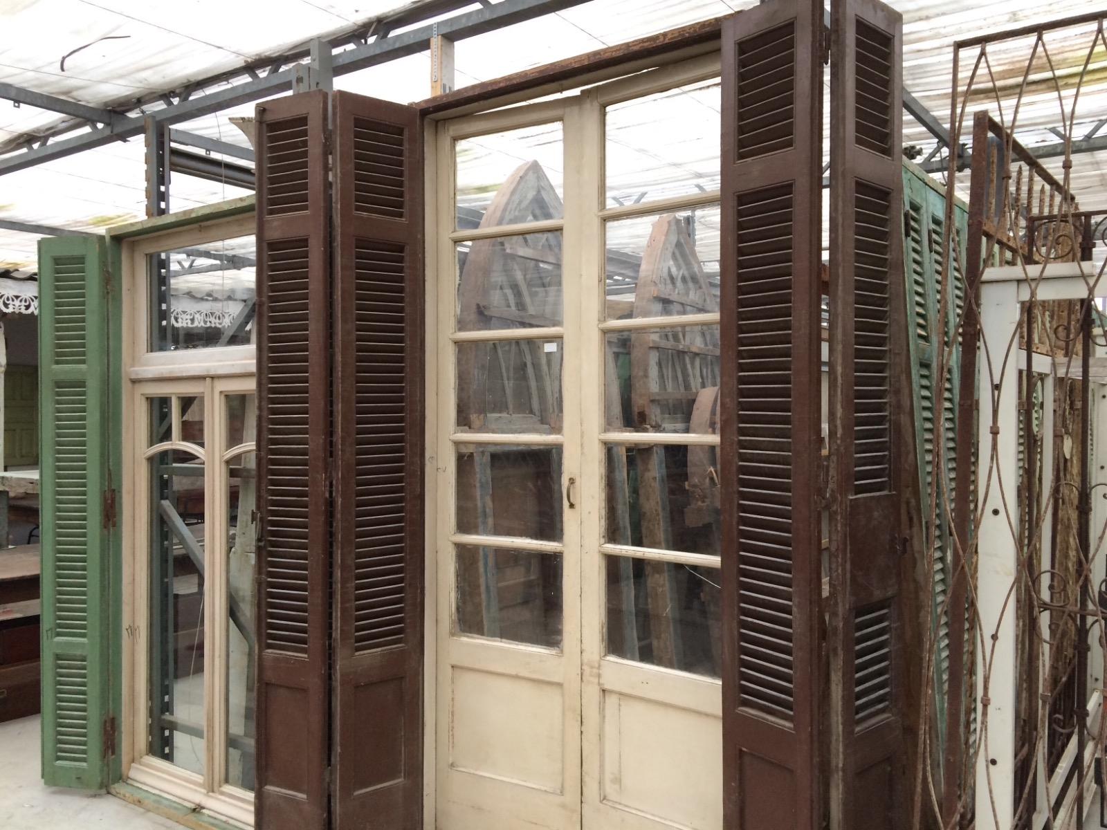 Antique frame with glass doors and old shutters