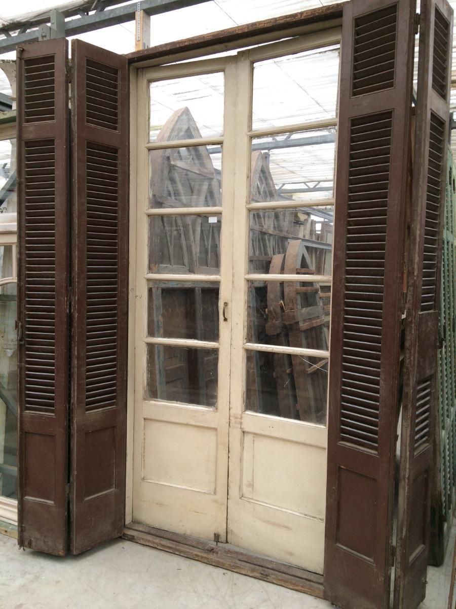 Antique frame with glass doors and old shutters