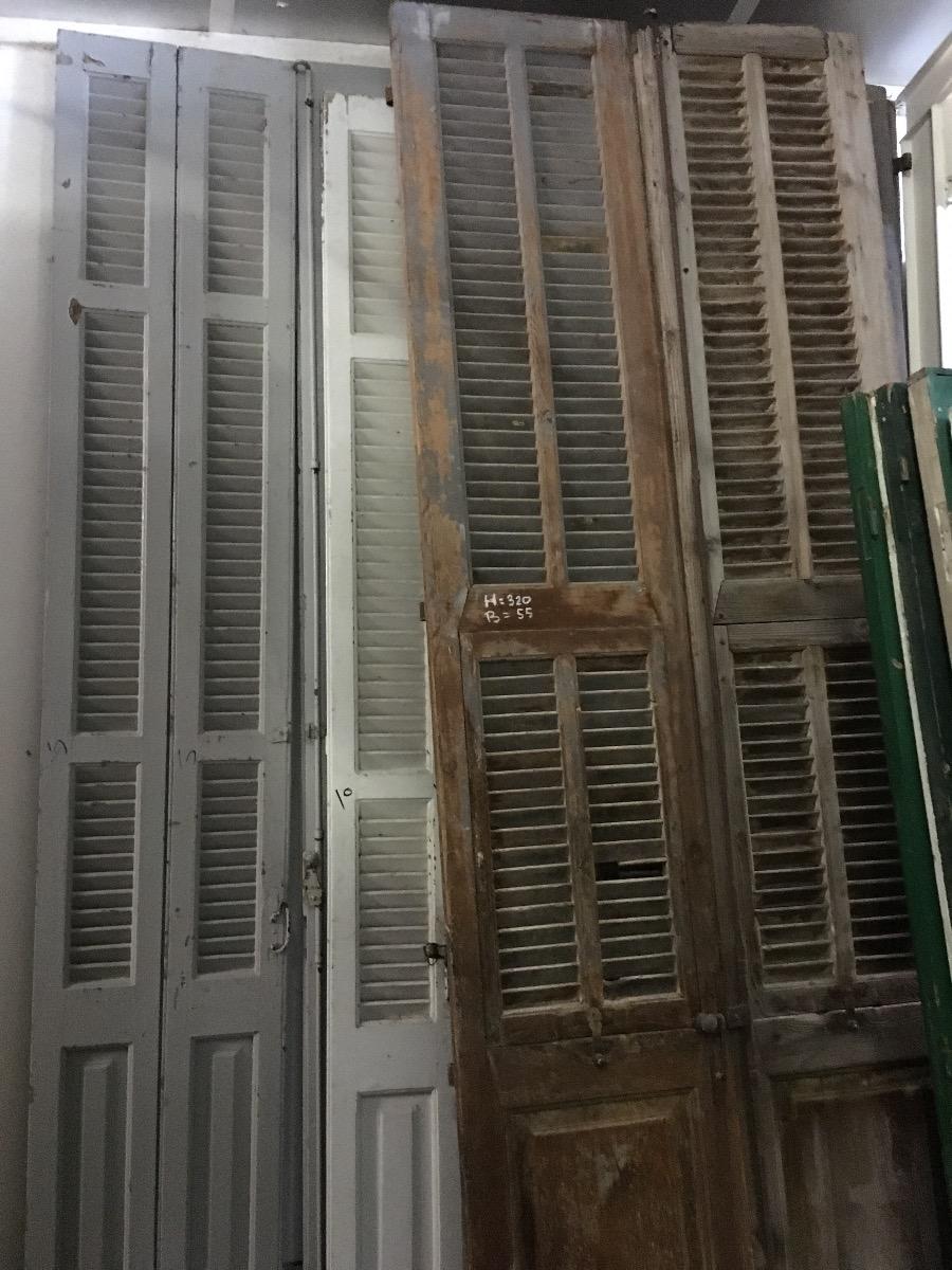 Antique high doors with shutter