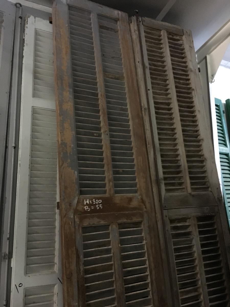 Antique high doors with shutter