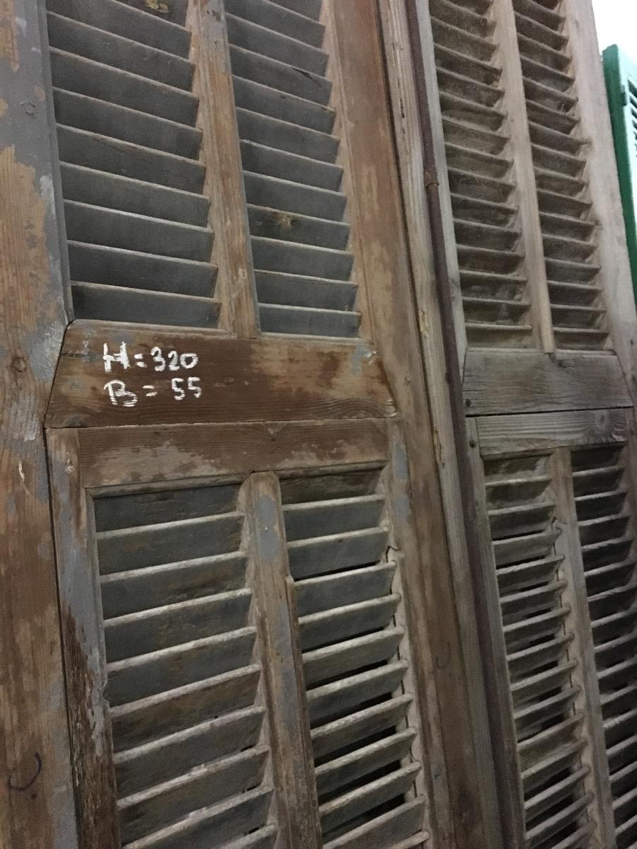 Antique high doors with shutter