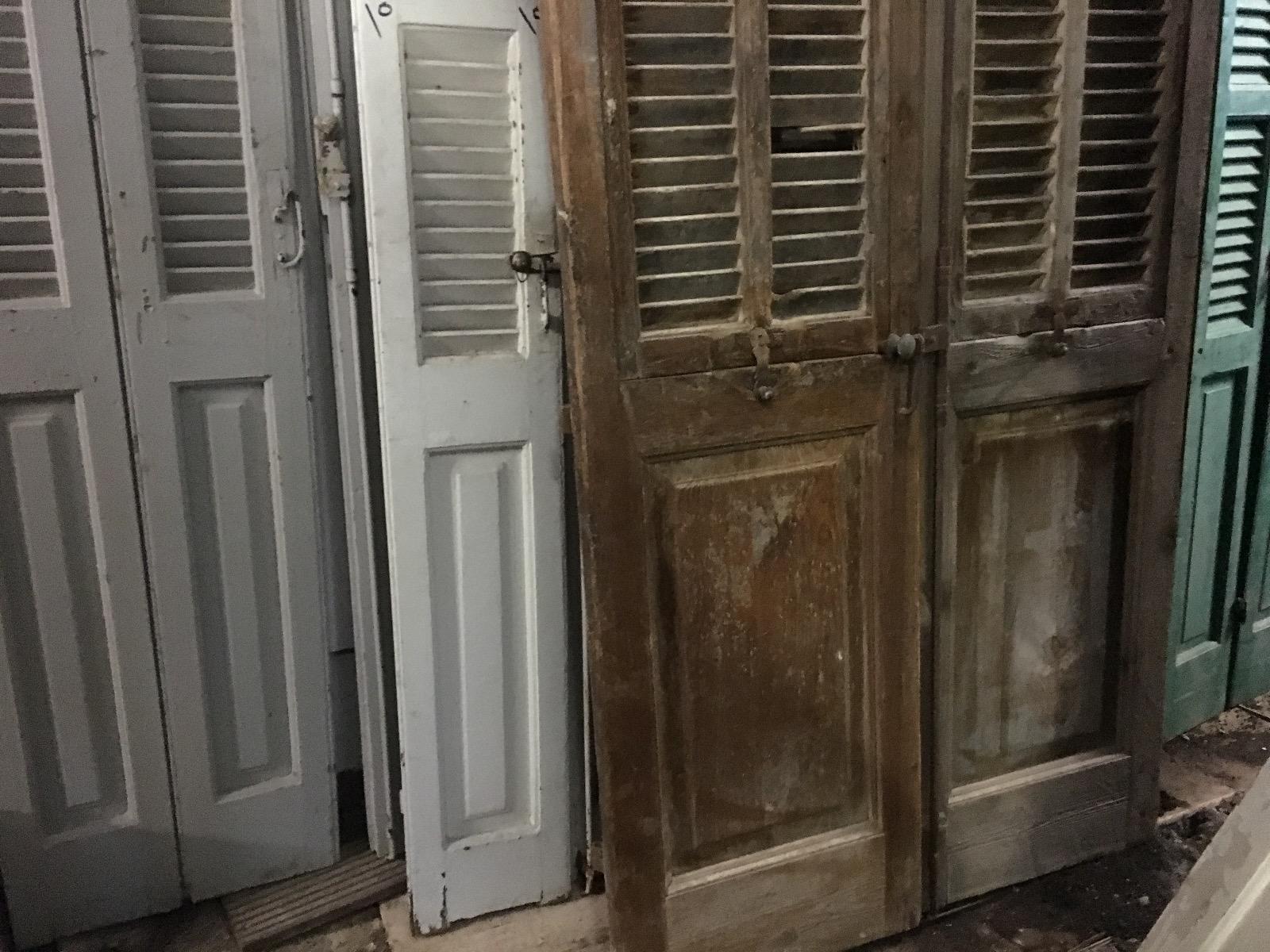 Antique high doors with shutter