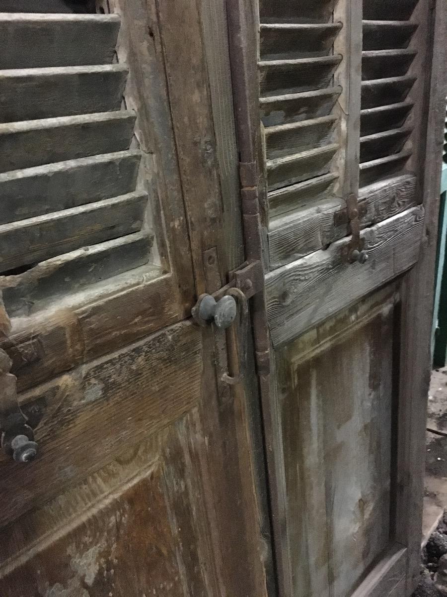 Antique high doors with shutter