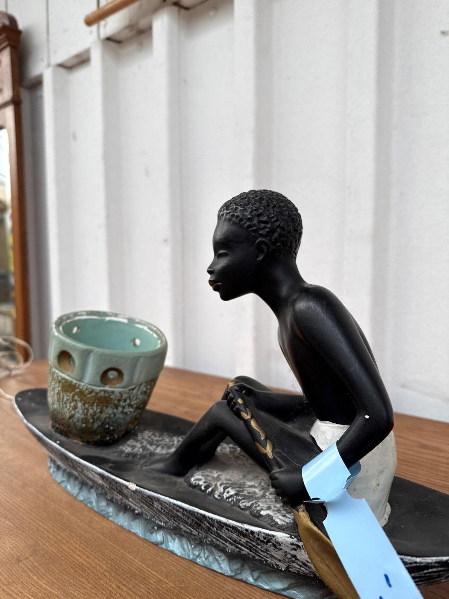 Antique Man in canoe lamp