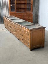 Antique shop counter with drawers and glass