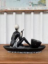 Antique style Statue of a woman in a canoe 1920