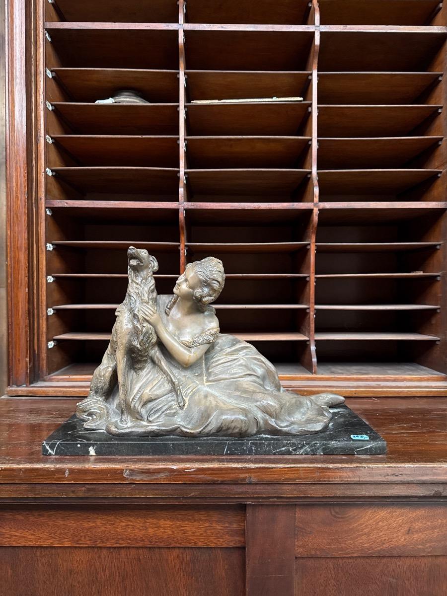 Antique Statue og a reclining woman and a dog