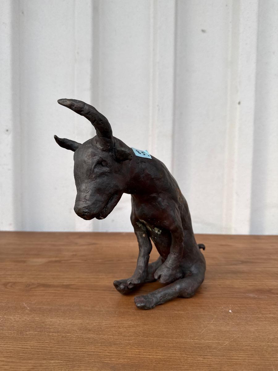 bronze statue of a seated bull